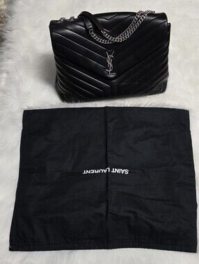 Saint Laurent Black Leather Shoulder Bag with Silver Zipper.